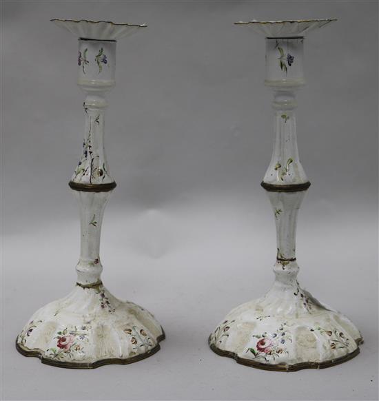 A pair of 18th century English enamel candlesticks	 26cm.
